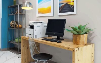 Business center with computer and printer at Days Inn By Wyndham Staten Island.