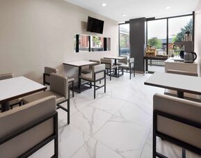 Dining area with comfortable seating, perfect for co-working at Days Inn By Wyndham Staten Island.