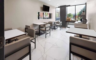 Dining area with comfortable seating, perfect for co-working at Days Inn By Wyndham Staten Island.