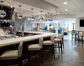 On-site bar with lounge area at Sheraton Miami Airport Hotel.