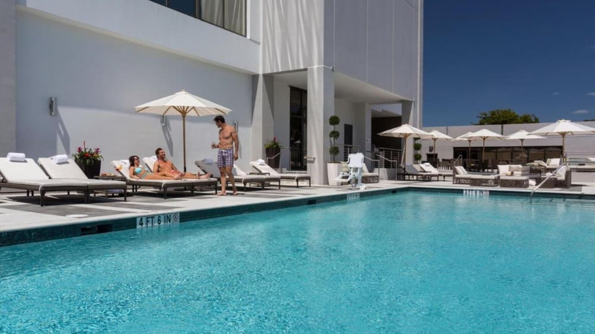 Outdoor pool with lounge chairs at EB Hotel Miami.