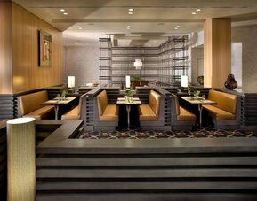 Dining area with comfortable seating, perfect for co-working at EB Hotel Miami.