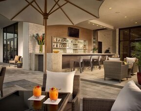 Hotel bar at the terrace with comfortable seating at EB Hotel Miami.