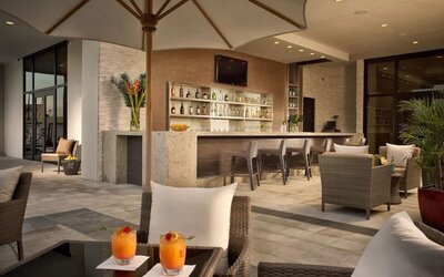 Hotel bar at the terrace with comfortable seating at EB Hotel Miami.