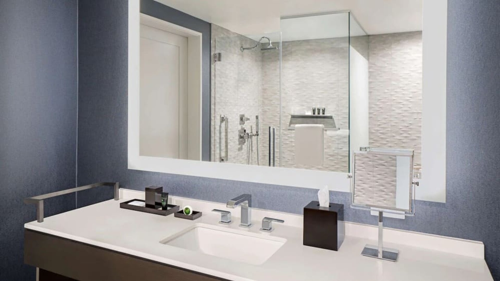 Private guest bathroom with shower and free toiletries at Hyatt Centric Brickell Miami.