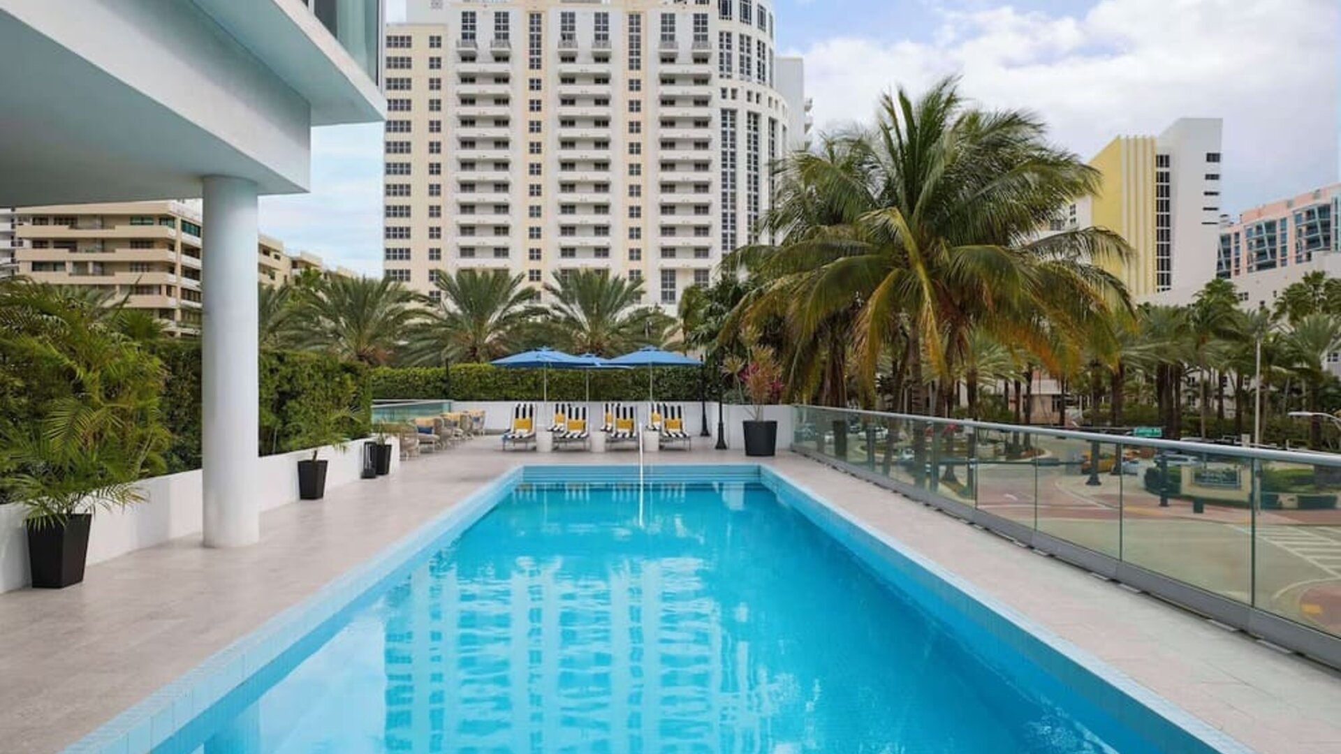 Outdoor pool with lounge seating at Hyatt Centric Miami South Beach.