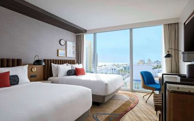 Day use twin room with floor to ceiling windows, work desk and private bathroom at Hyatt Centric Miami South Beach.