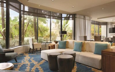 Hotel lobby with comfortable seating and workspace at Hilton Miami Airport Blue Lagoon.