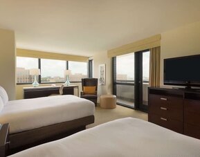 Day use twin room with work desk, balcony and private bathroom at Hilton Miami Airport Blue Lagoon.