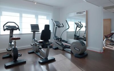 Fitness center at Sheraton Paris Charles De Gaulle Airport Hotel.