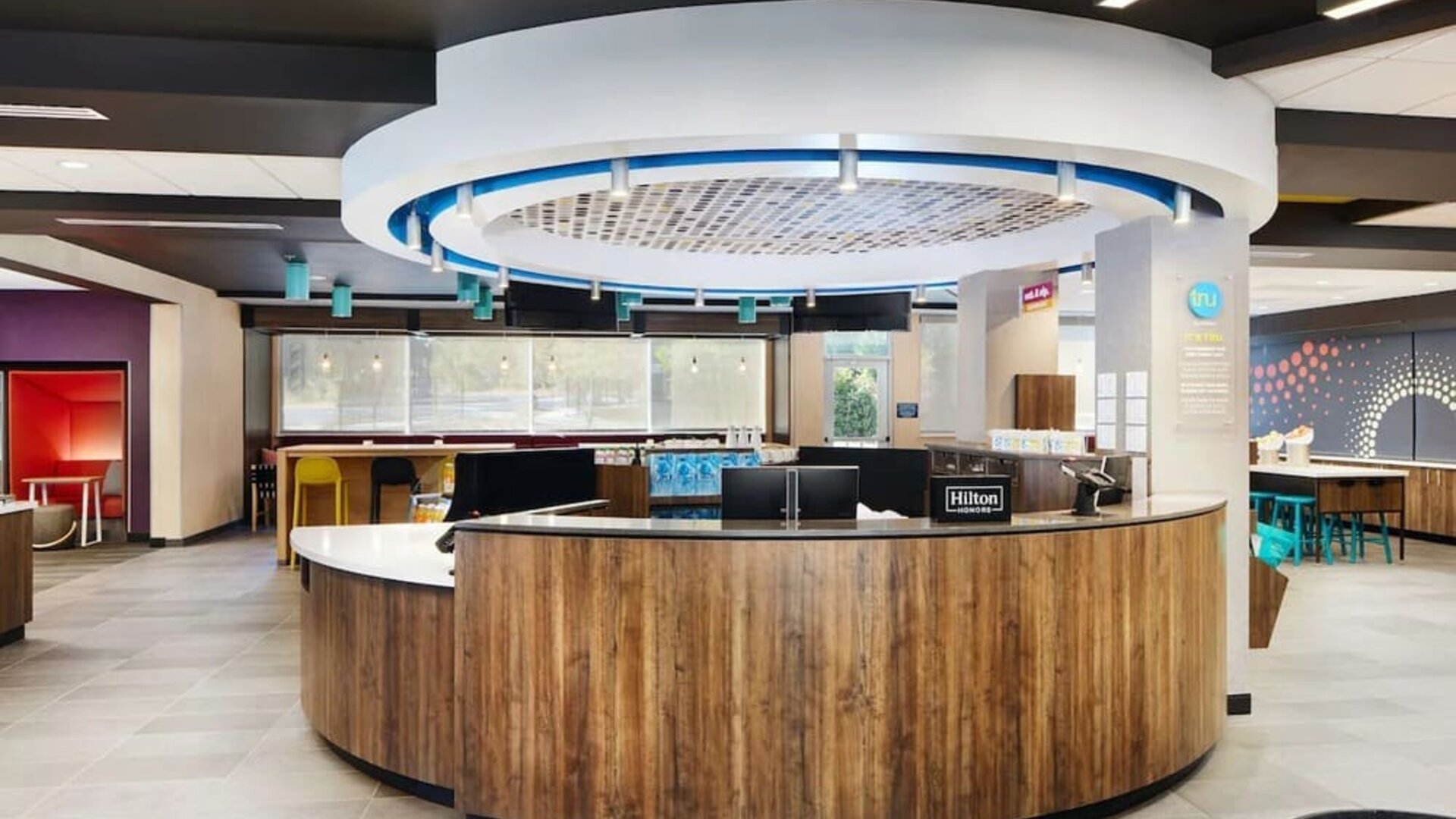 Reception desk at Tru By Hilton Atlanta Northlake Parkway.