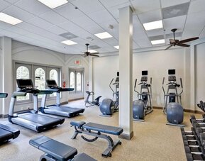 Fully equipped fitness center at Embassy Suites By Hilton Miami - International Airport.