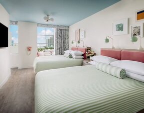 Day use twin room with lounge chairs and private bathroom at The Goodtime Hotel.