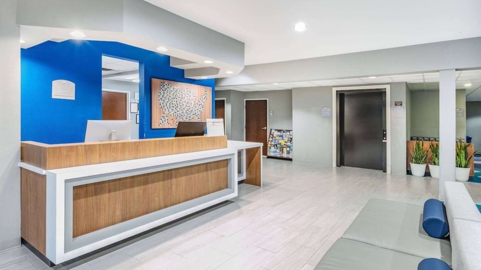 Reception desk at Microtel Inn And Suites By Wyndham Austin Airport.