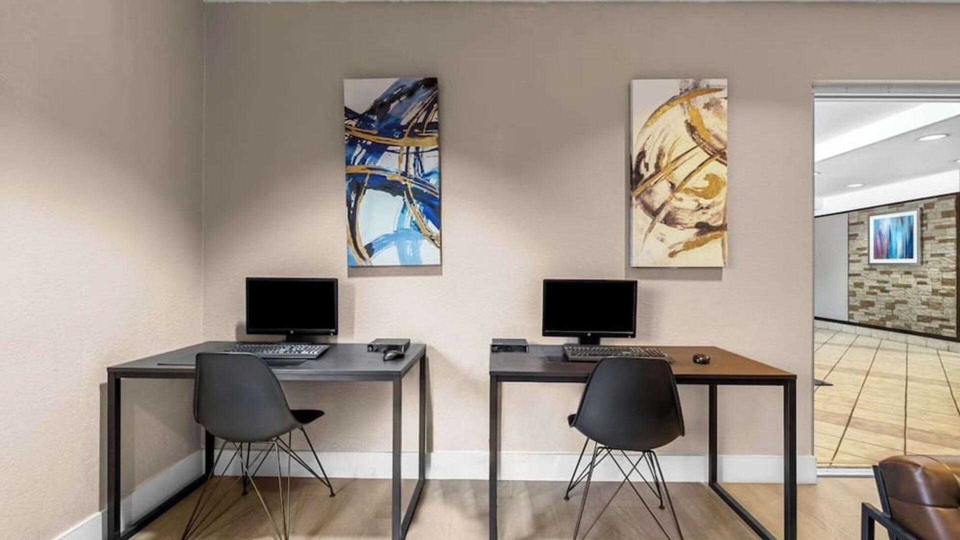 Business center with PC, internet, and printer at Suburban Studios Orlando - Ocoee/Winter Garden.