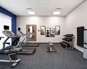 Gym at Home2 Suites By Hilton San Francisco Airport North.