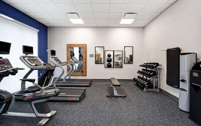 Gym at Home2 Suites By Hilton San Francisco Airport North.