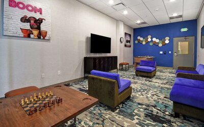 Coworking space and lounge at Home2 Suites By Hilton San Francisco Airport North.
