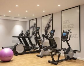 Fitness center at Hilton Garden Inn Paris Orly Airport.