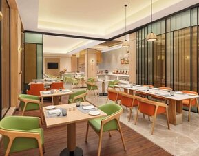 Dining area at Hilton Garden Inn Surat City Centre.