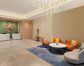 Lobby seating at Hilton Garden Inn Surat City Centre.