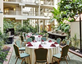 Outdoor seating and terrace at Embassy Suites By Hilton Parsippany.