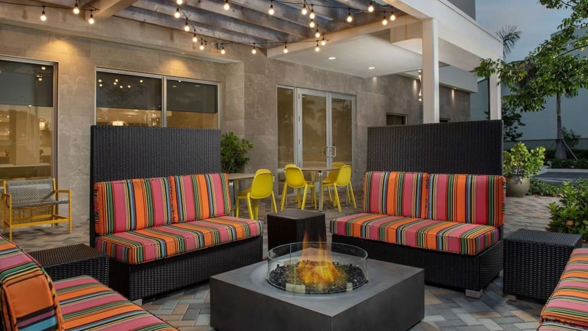 Outdoor seating at Home2 Suites By Hilton Miami Doral West Airport.
