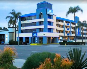 Hotel exterior at Capri Suites Anaheim.