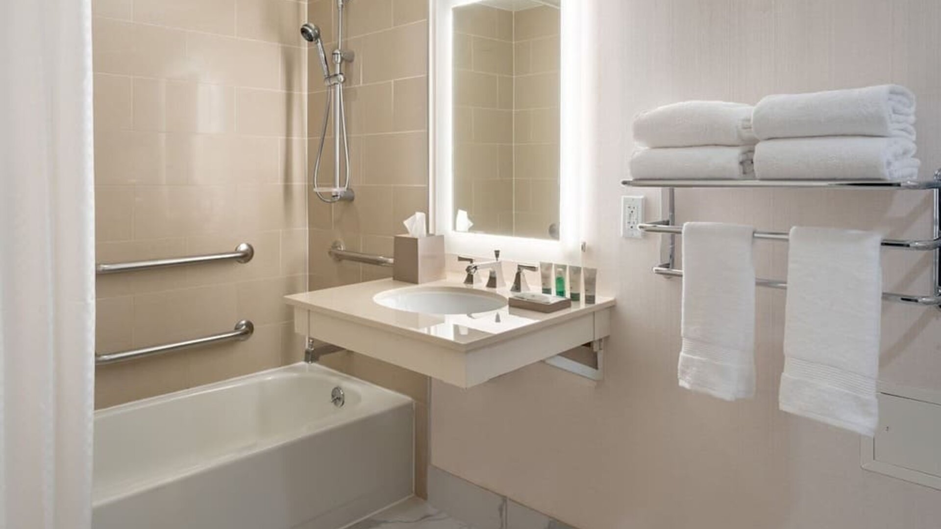 Guest bathroom with shower and tub  at Westin Atlanta Airport Hotel.