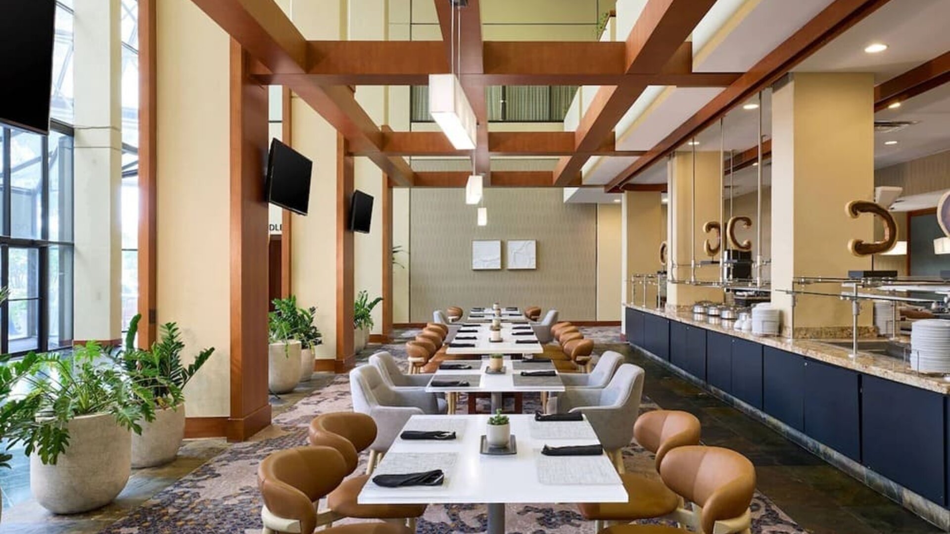 Dining area with natural light perfect for coworking at Westin Atlanta Airport Hotel.
