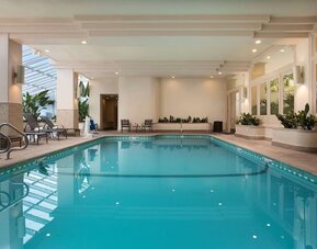Relaxing indoor pool at Embassy Suites by Hilton San Francisco Airport.
