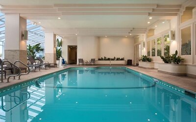 Relaxing indoor pool at Embassy Suites by Hilton San Francisco Airport.