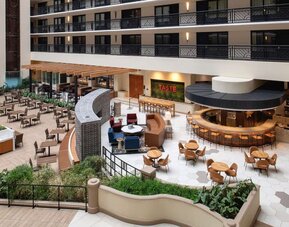 Spacious dining and lounge area perfect for coworking at Embassy Suites by Hilton San Francisco Airport.