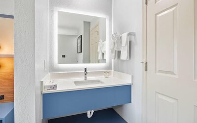 Guest bathroom at AmericInn By Wyndham Urbana.