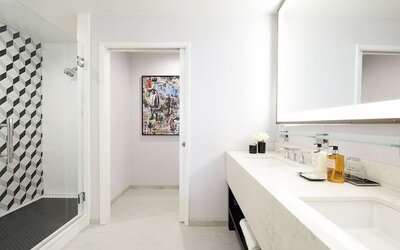 Private guest bathroom with shower and free toiletries at Montrose At Beverly Hills.