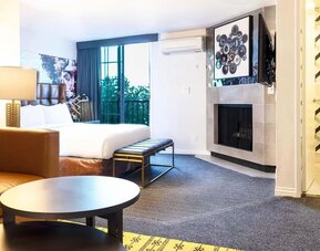 Day use suite with living room and fireplace at Montrose At Beverly Hills.
