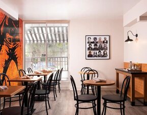 Dining area with comfortable seating, perfect for coworking at Montrose At Beverly Hills.