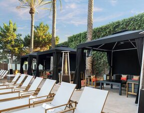 Plenty of sun loungers and cabanas available beside the pool at Marriott Del Mar.