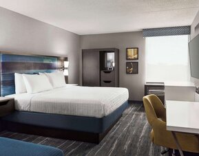 Day use room with work desk, private bathroom and natural light at Hampton Inn Chicago-O'Hare International Airport.