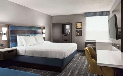 Day use room with work desk, private bathroom and natural light at Hampton Inn Chicago-O'Hare International Airport.