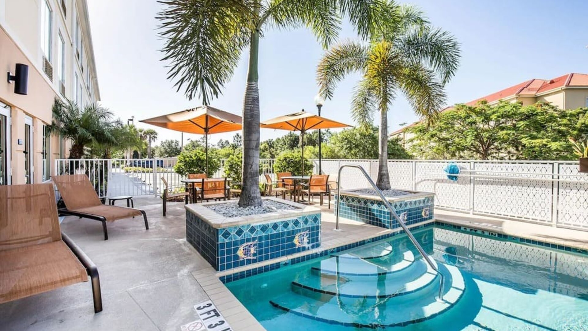 Outdoor pool at Sleep Inn & Suites Port Charlotte - Punta Gorda.