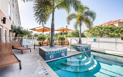 Outdoor pool at Sleep Inn & Suites Port Charlotte - Punta Gorda.