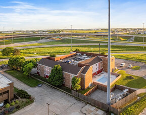 Property exterior at Coratel Plus Suites Wichita West Airport.