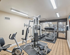 Fitness center at Coratel Plus Suites Wichita West Airport.