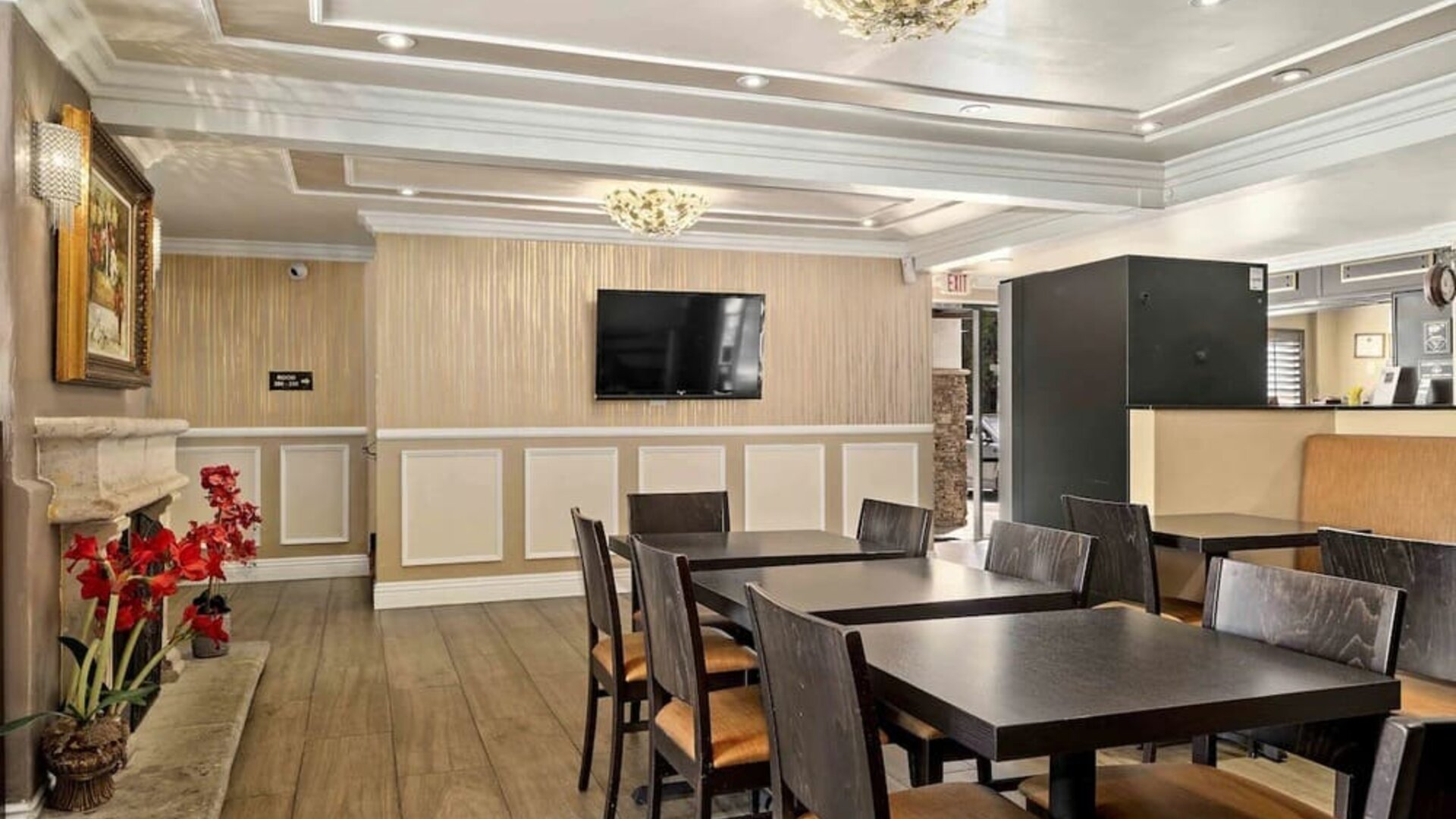 Lobby seating and restaurant at Lemon Tree Hotel & Suites Anaheim.