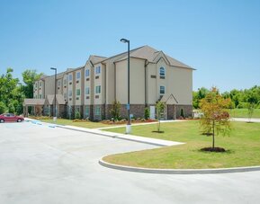 Hotel exterior at WeStay Suites Belle Chasse.