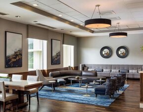 Lounge area with natural light at Boston Marriott Newton.