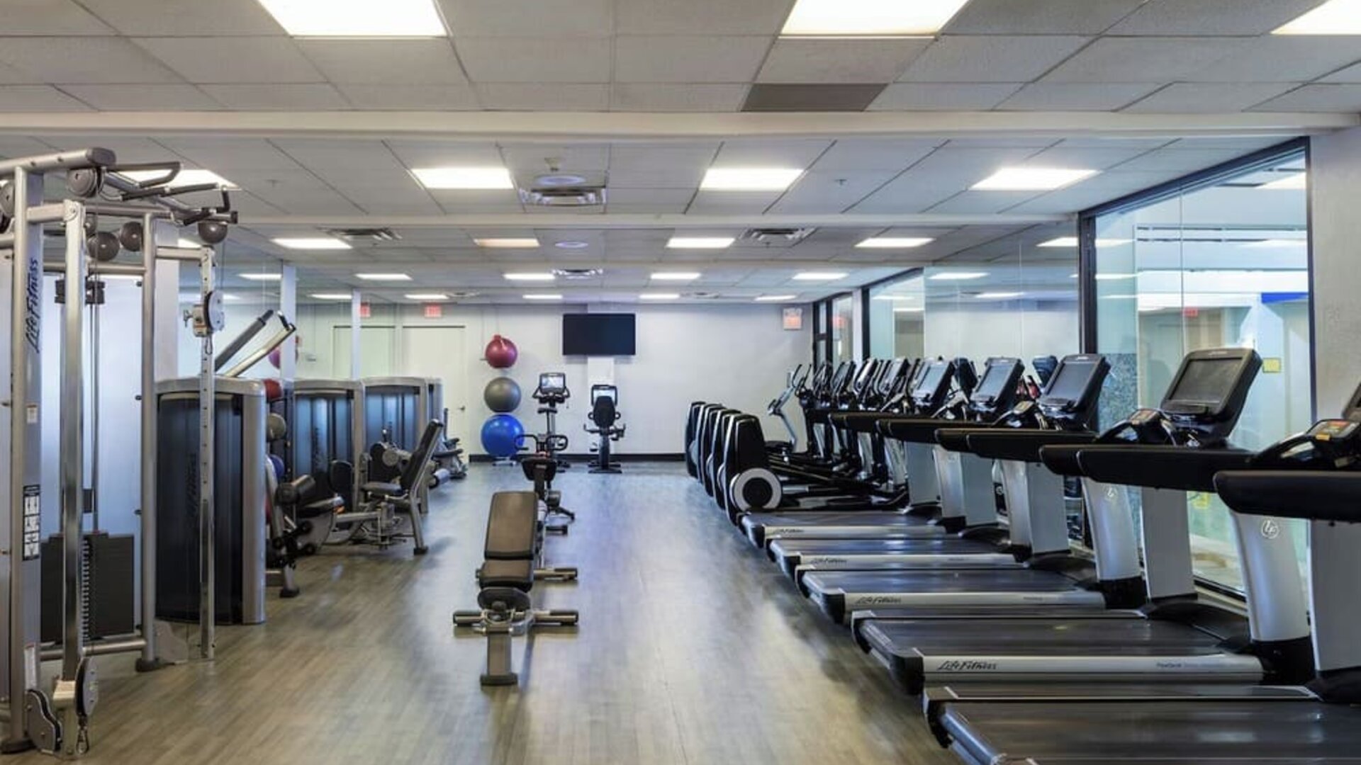 Fully-equipped fitness center at Boston Marriott Newton.