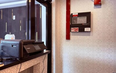 Reception desk at THE VINE HOTEL BRONX.