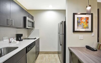 Kitchen at Homewood Suites By Hilton Orlando Theme Parks.